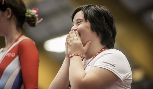 A woman with a learning disability at a sporting event