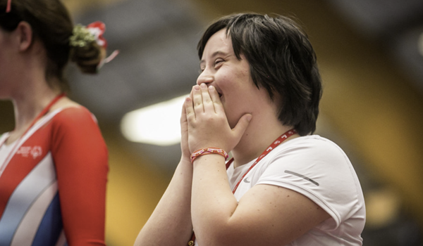 A woman with a learning disability at a sporting event 